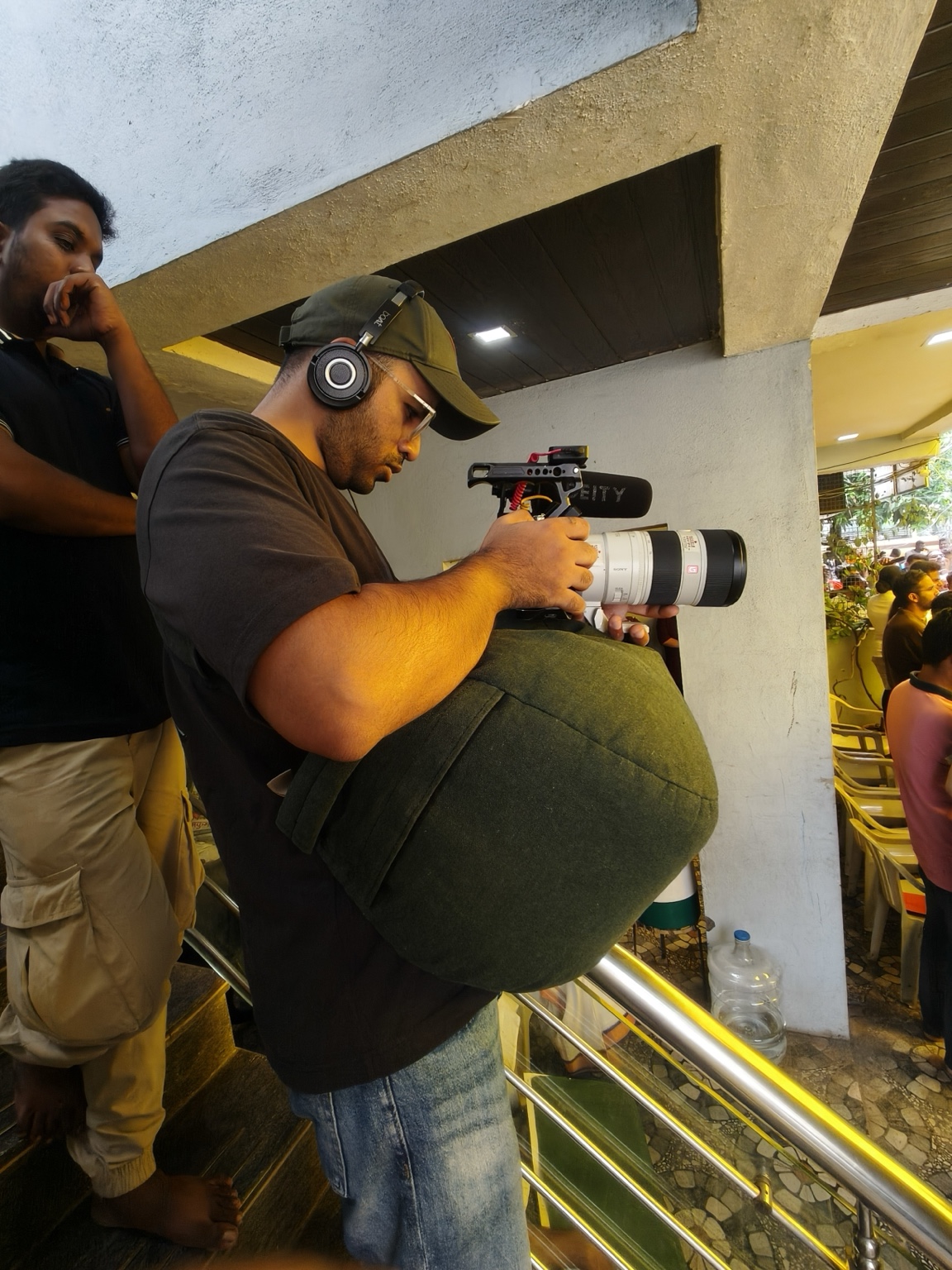 Filming with a telephoto lens during a public gathering